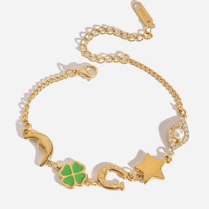 สร้อยข้อมือชาร์มโทนสีทอง จี้รูปใบโคลเวอร์สี่แฉก พระจันทร์ และดวงดาว เครื่องประดับสำหรับผู้หญิง ของขวัญ เครื่องประดับแฟชั่น - Product Image 1