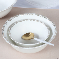 Service de table royal vaisselle en céramique fabriquée en Chine assiettes à dîner végétales bols nordiques service de table de luxe vaisselle blanche et argentée