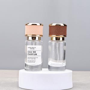 Botella de Perfume Cilíndrica de Alta Gama de 20 ml, Atomizador Portátil Vacío para Subenvasado, Tipo Presión con Tapa de Rosca para Viajes - Product Image 1