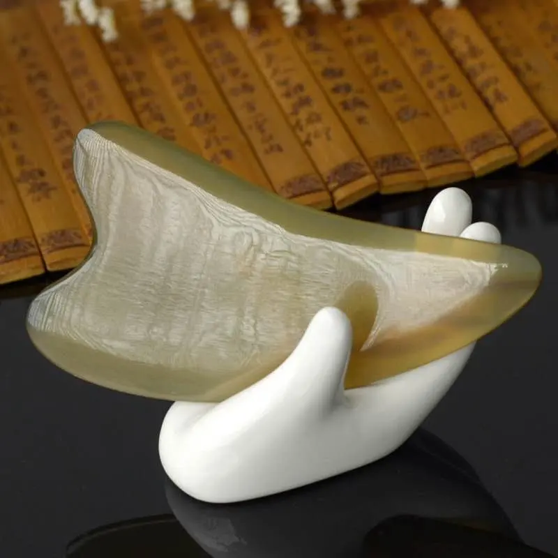 Strumento di massaggio facciale per la cura della pelle del corpo tradizionale cinese corno naturale piastra di agopuntura massaggio Guasha bordo corno