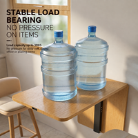 Support mural ultra-fin pour table pliante, avec amortissement doux et système de levage.