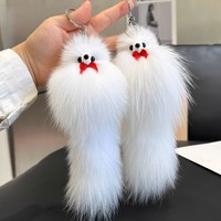Porte-clés queue de renard véritable mignon avec nœud papillon, pendentif animal doux et moelleux pour la décoration de sacs et accessoires féminins