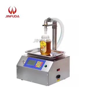 Machine de remplissage de miel de pesage à grand débit Machine de remplissage/remplissage de pâte de sésame d'huile comestible à usage domestique et commercial
