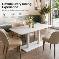 Table de restaurant, plateau en pierre frittée avec base à double colonne blanche et design de table aux coins arrondis pour hôtel et café