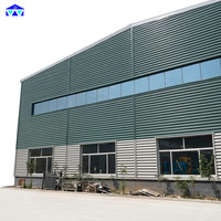 Bâtiment d'entrepôt préfabriqué à grande portée en acier Q355B avec de grands fenêtres
