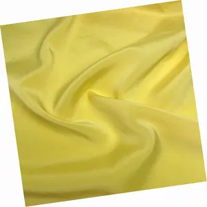 パンツスカート唐スーツパジャマ用スパンデックス織り無地生地を使用した最高品質の滑らかな黄色の弾性ストレッチシルクハボタイ