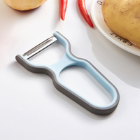 Éplucheur de légumes ergonomique avec poignée antidérapante en acier inoxydable, design moderne pour la maison et la restauration, idéal pour les pommes de terre, les pommes et les carottes