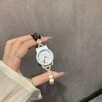 Petite montre-bracelet en alliage pour femme, écologique, artistique, à mouvement à quartz, style dessin animé mignon et de niche, idéale pour les meilleures amies et les étudiantes