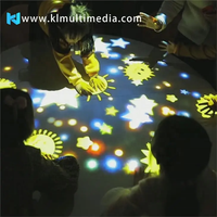 Mesa de juegos interactiva 3D redonda para niños, máquina digital eléctrica todo en uno para juegos de proyección de vídeo gestual en restaurante