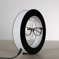 Vente en gros de présentoir créatif pour lunettes à lévitation magnétique, éclairage LED, présentoir rotatif pour lunettes de soleil