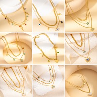 Collier superposé en acier inoxydable plaqué or 18 carats avec pendentif émeraude vert, breloque étoile et chaîne de pull pour femme