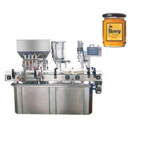Machine de remplissage de pots de miel à 4 têtes, machine de remplissage et de bouchage automatique de haute précision pour huile médicale en verre numérique