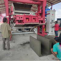 Machine automatique de formage de béton pour puits de visite, bordures, caniveaux et barrières routières