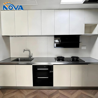 Meuble de cuisine moderne en L, corps en MDF, porte laquée brillante avec panneau d'îlot, vente en gros