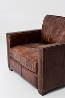 Fauteuil Chesterfield en cuir marron |   Fauteuil lounge vintage en cuir véritable avec dossier capitonné et pieds en bois |   Salon avec un seul siège