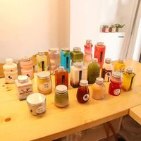 Machine d'emballage et de scellage manuelle de bouteilles en plastique Jiahe pour les boissons, les gobelets à jus, calibre 51 mm, 250 ml, 330 ml, 400 ml, 500 ml, 700 ml