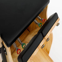 Chaise Wunda de Pilates en bois de chêne pour studio, à résistance divisée, pour la précision et la stabilité du mouvement
