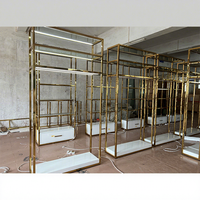 Étagère de présentation de vêtements pour boutique, présentoirs à vêtements dorés, étagères pour magasin de vêtements, présentoirs à vêtements en métal pour la vente au détail