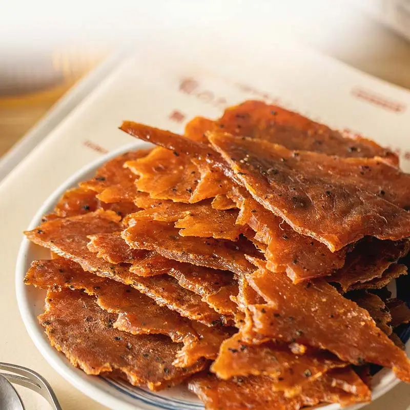 Chine Vente chaude Délicieux Snack de viande Tranche de porc séchée Nutrition instantanée Viande de porc Jerky