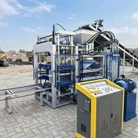Machine de moulage de blocs de béton QT4-15 à commande PLC, avec moteur, pompe et boîte de vitesses, haute production, pour pavés autobloquants et briques pleines ou creuses