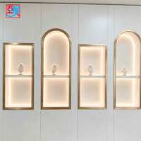 Vitrine murale incurvée pour bijoux, présentoir à bijoux, armoire en verre éclairée par LED pour bijouterie, personnalisable