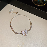 Bracelet coulissant en fer avec fleur en zircon de style coréen, luxe léger, sophistiqué, doux, frais, élégant et polyvalent, vente en gros