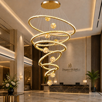 Lustre en cristal spirale multi-anneaux doré de luxe pour hall d'hôtel, design personnalisé avec cadre métallique rond, lampe suspendue pour villa
