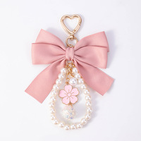 Porte-clés élégant avec nœud en perles, pendentif décoratif pour sac à main pour filles