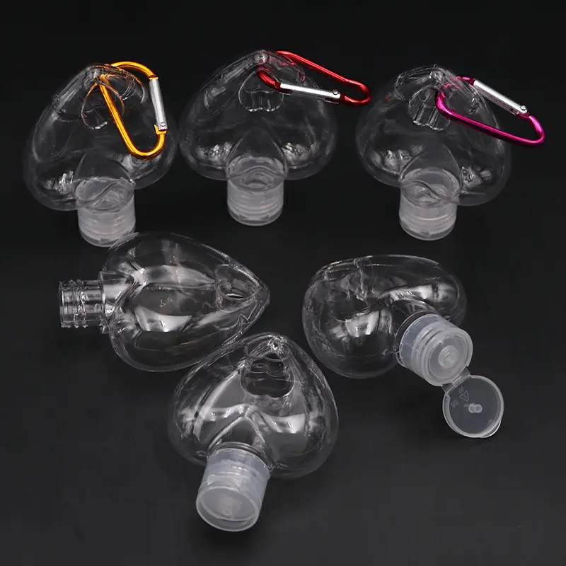 DDA1110 conteneurs rechargeables bouteilles vides de Gel de lavage des mains en forme de cœur 50ml bouteille de crochet en plastique transparent avec porte-clés