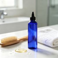 Bouteille d'huile capillaire en plastique PET de 250 ml (8 oz) en forme de balle bleue avec bouchon à vis et applicateur compressible, personnalisable avec étiquette et logo