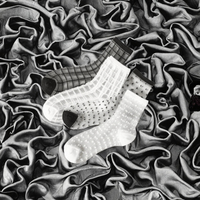 Vente en gros de bas en soie pour femmes de haute qualité, fins, tricotés, à carreaux, rayés, à pois, transparents, design personnalisé, corps transparent