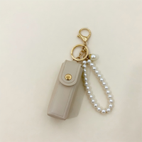 Joli porte-rouge à lèvres en cuir PU avec porte-clés en perles, breloque de sac, porte-rouge à lèvres portable, porte-clés de voiture pour femmes et filles