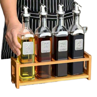 Bouteilles d'huile d'olive en verre transparent de qualité supérieure avec bouchon compte-gouttes pour l'emballage alimentaire gastronomique en gros