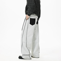 Jean ample pour homme en denim délavé clair, coupe droite, design patchwork gris et blanc, style rétro américain tendance