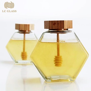Toples madu kaca kosong segi enam mewah kualitas tinggi dengan tutup bambu & toples madu kaca heksagonal untuk penggunaan di rumah - Product Image 1