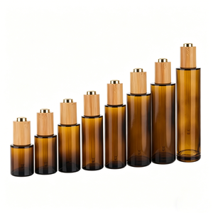 Vente en gros de flacons compte-gouttes en verre ambré vides avec bouchons en bambou pour les parfums, les soins de la peau et les sérums - Product Image 1