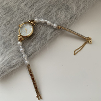 Montre française à petit cadran elliptique avec chaîne en perles naturelles, montre d'affaires, montre tendance pour femmes