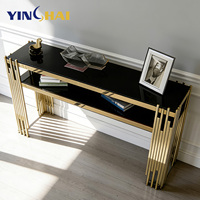 Table console de luxe en acier inoxydable 201 avec cadre en métal doré sur mesure, plateau en verre noir, mobilier pour suite d'hôtel