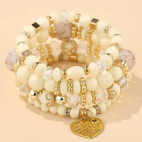 Ensemble de 4 bracelets élégants pour femmes, style bohème ethnique, avec pendentif en forme de cœur, multi-couches, perles