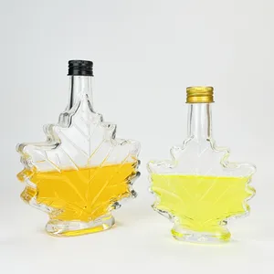 Manufacturer Wholesale 50ml 100ml 250ml Maple Leaf Shaped Glass Bottle Food Grade Storage Wine Beverage Syrup Bottle