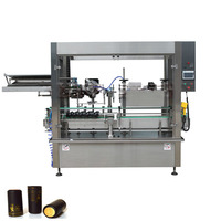 Machine de pose et de rétrécissement de capsules de vin en aluminium, machine de pose et de sertissage de capsules de bouteilles de vin en PVC et en aluminium multicouche