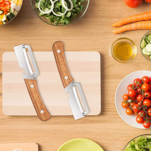 NOUVEAU <span class=keywords><strong>Éplucheur</strong></span> <span class=keywords><strong>manuel</strong></span> <span class=keywords><strong>de</strong></span> légumes et fruits antidérapant pour la cuisine, couteau à éplucher en acier inoxydable avec manche en bois - Product Image 1