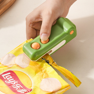 <b>Mini</b> Sealing <b>Machine</b> Green Purple Color Household Snack Packaging Tool With Magnetic Strip For Food Preservation - Product Image 3