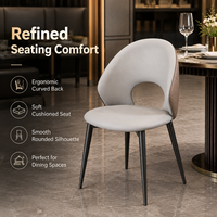 Chaise de salle à manger moderne à dossier ouvert, assise rembourrée grise courbée et matelassée avec pieds en métal pour hôtel et restaurant