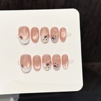 Faux ongles à presser pour femmes, rose nude transparent, courts, forme amande, avec perles et grappe de cristaux, pour un style chic et éclatant, vente en gros