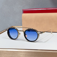 Lunettes de soleil unisexes rétro rondes de luxe, monture noire à double pont, protection UV400, idéales pour la conduite, les voyages et les soirées.