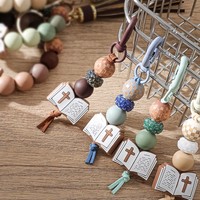 Porte-clés bracelet en perles de silicone avec pompon en cuir PU, breloque croix biblique, pendentif pour sac à main femme