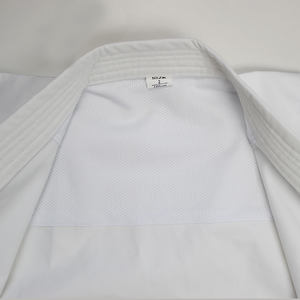 Çin üreticileri tarafından üretilen dövüş sanatları <span class=keywords><strong>Kimono</strong></span> jiu jitsu judo ekipmanları JUDO kıyafeti gi öğrenci beyaz/mavi özelleştirilmiş - Product Image 2