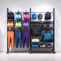 Porte-vêtements robuste en métal gris avec panneau grillagé, barre de suspension, roulettes et étagères, autoportant, CE ETL, vente en gros pour boutiques