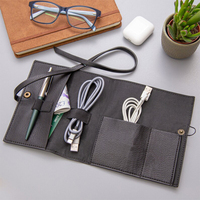 Sac de voyage multifonctionnel en cuir PU personnalisé avec rouleau de câble pochette d'emballage stocker tous vos câbles USB stylos écouteurs et chargeurs